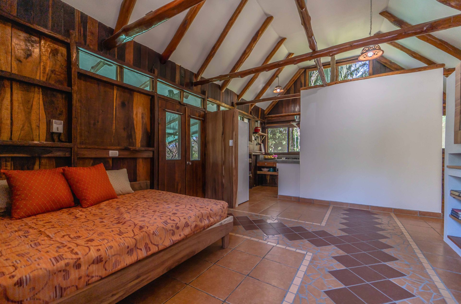 There is a large bed in the middle of the room.
