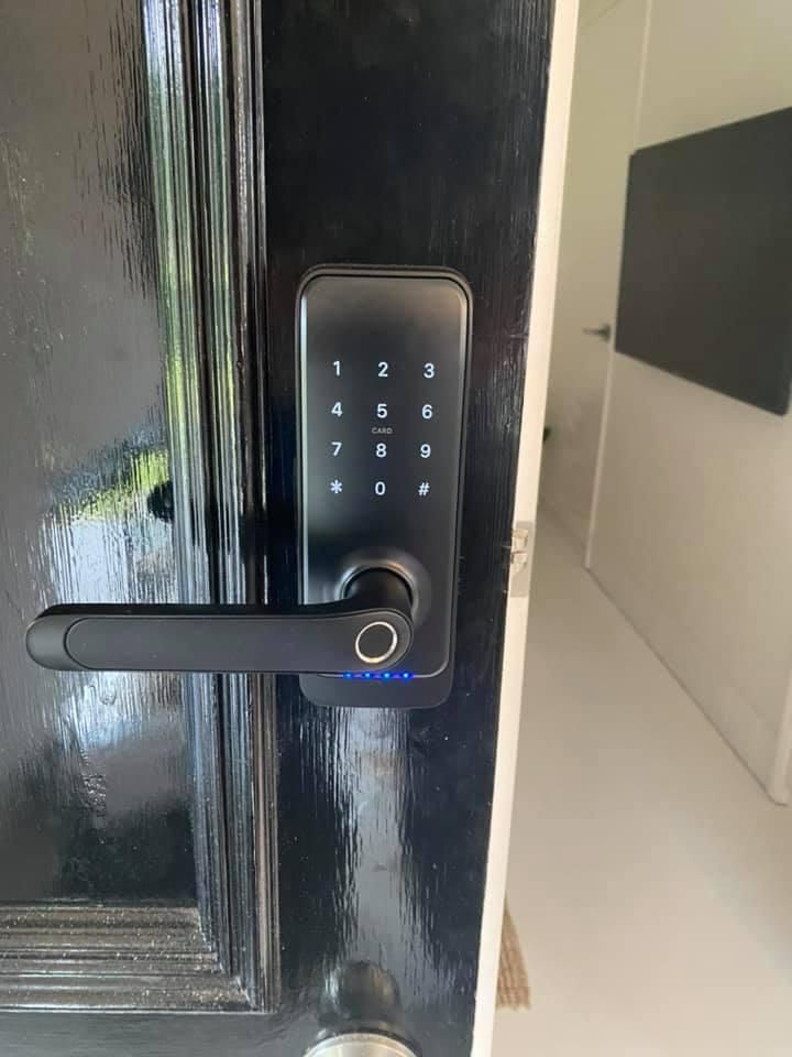 A Black Door with A Digital Lock on It — Fortress Locksmiths & Security in Lennox Head, NSW