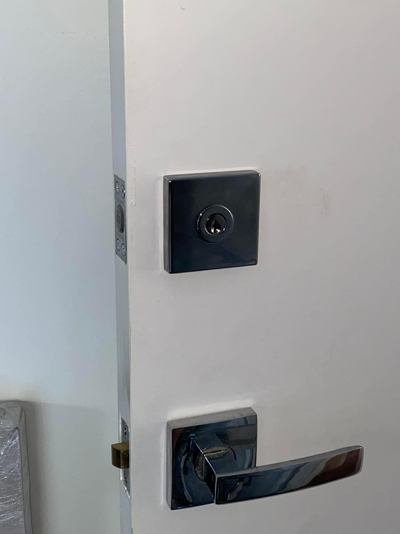 A Close up Of a Door Lock on A White Door — Fortress Locksmiths & Security in Lennox Head, NSW