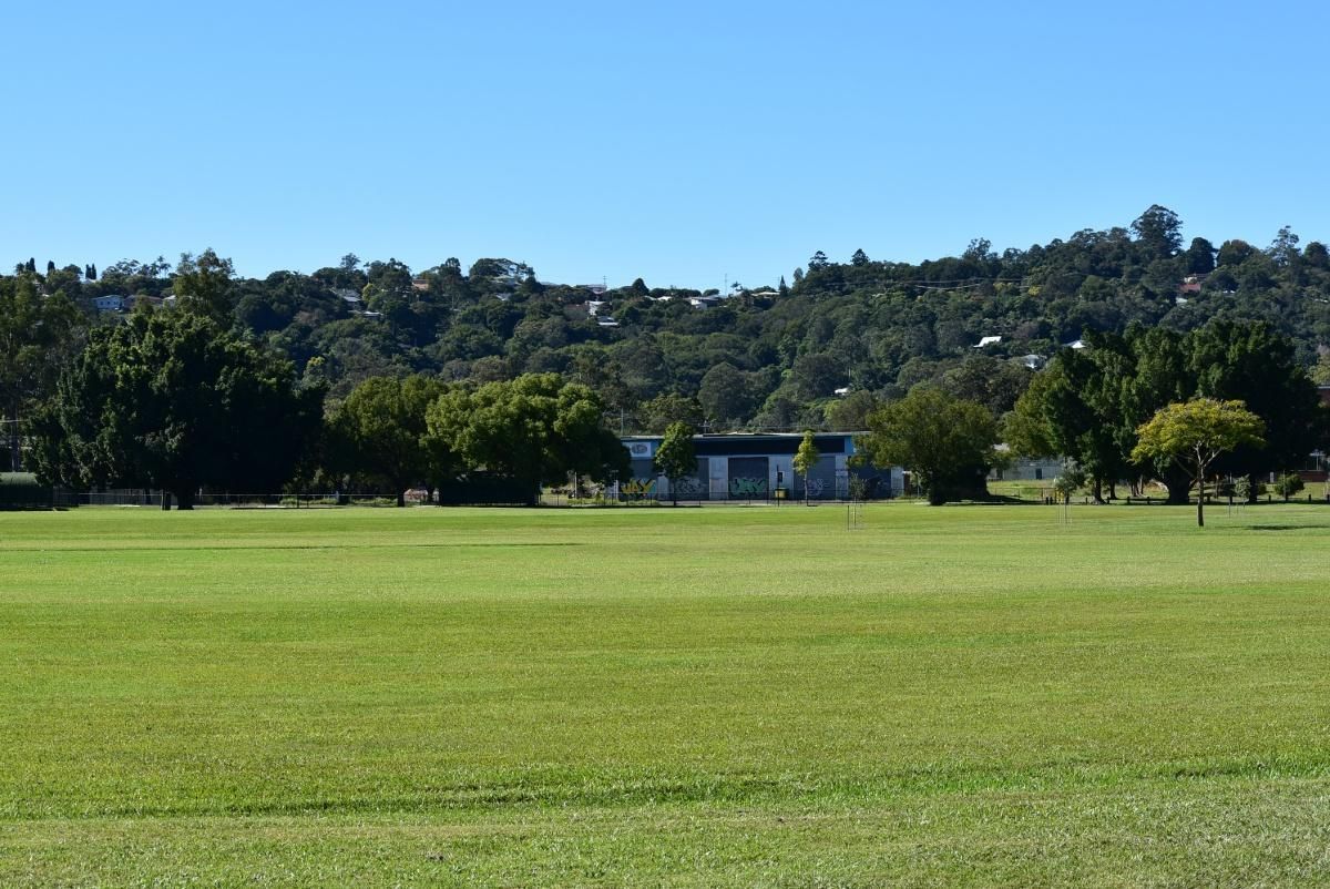 A Large Grassy Field with Trees in The Background — Fortress Locksmiths & Security in Lismore, NSW