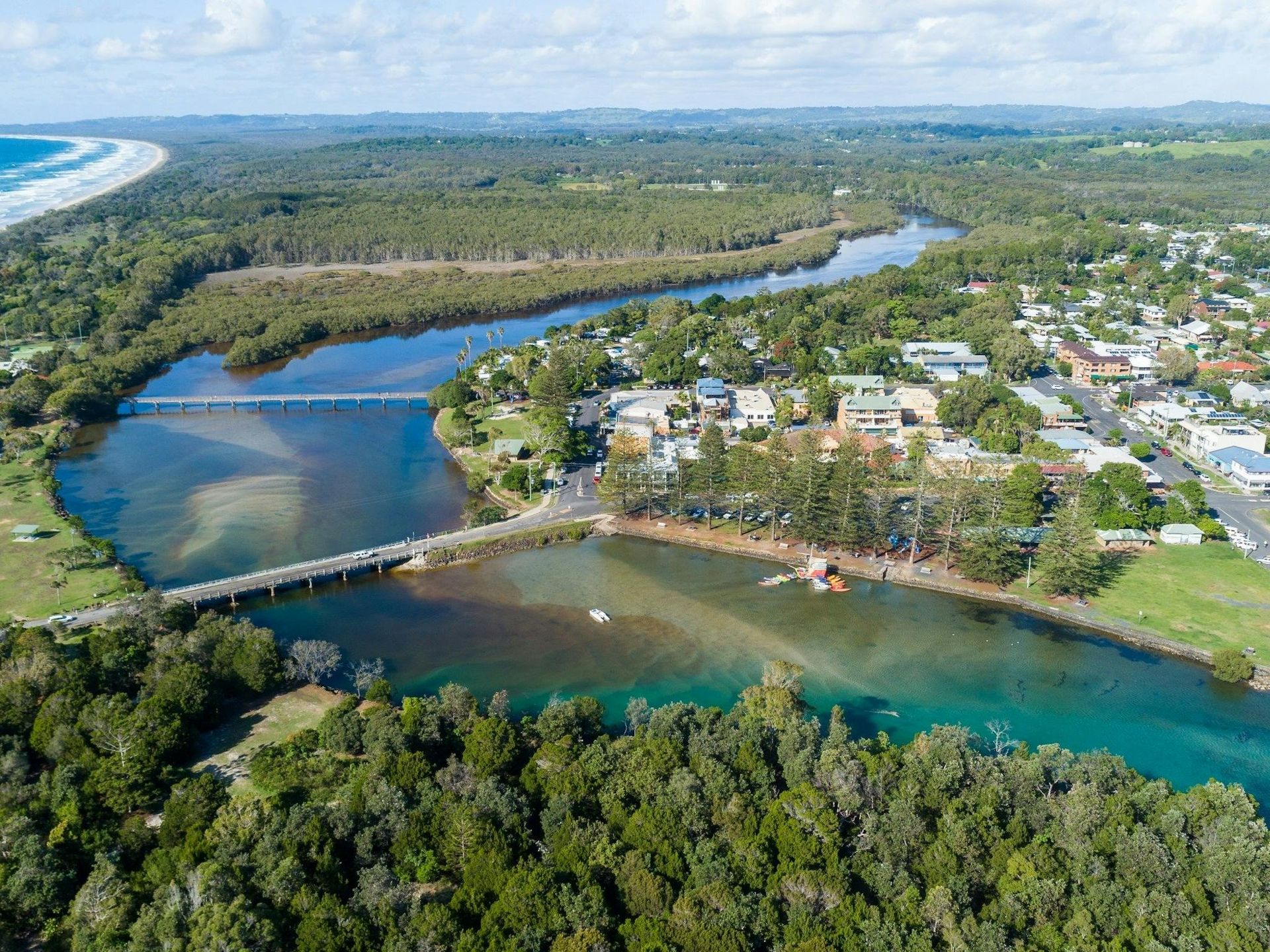 A Bridge Over a Body of Water with Trees in The Background — Fortress Locksmiths & Security in Brunswick Heads, NSW