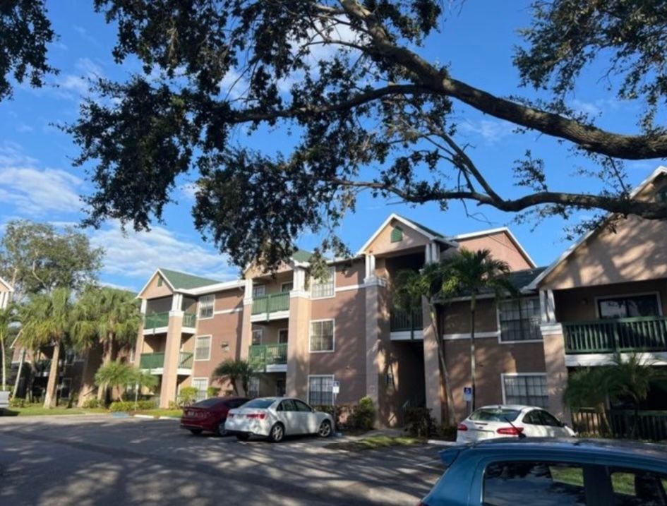 Condominium, homes, brown with green roofs and green railing