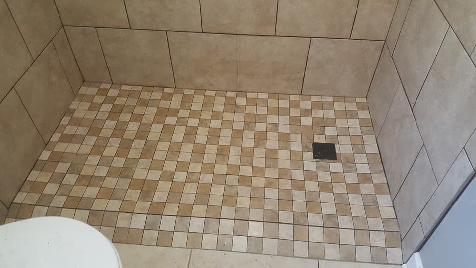 A black and white tile floor with a diagonal pattern