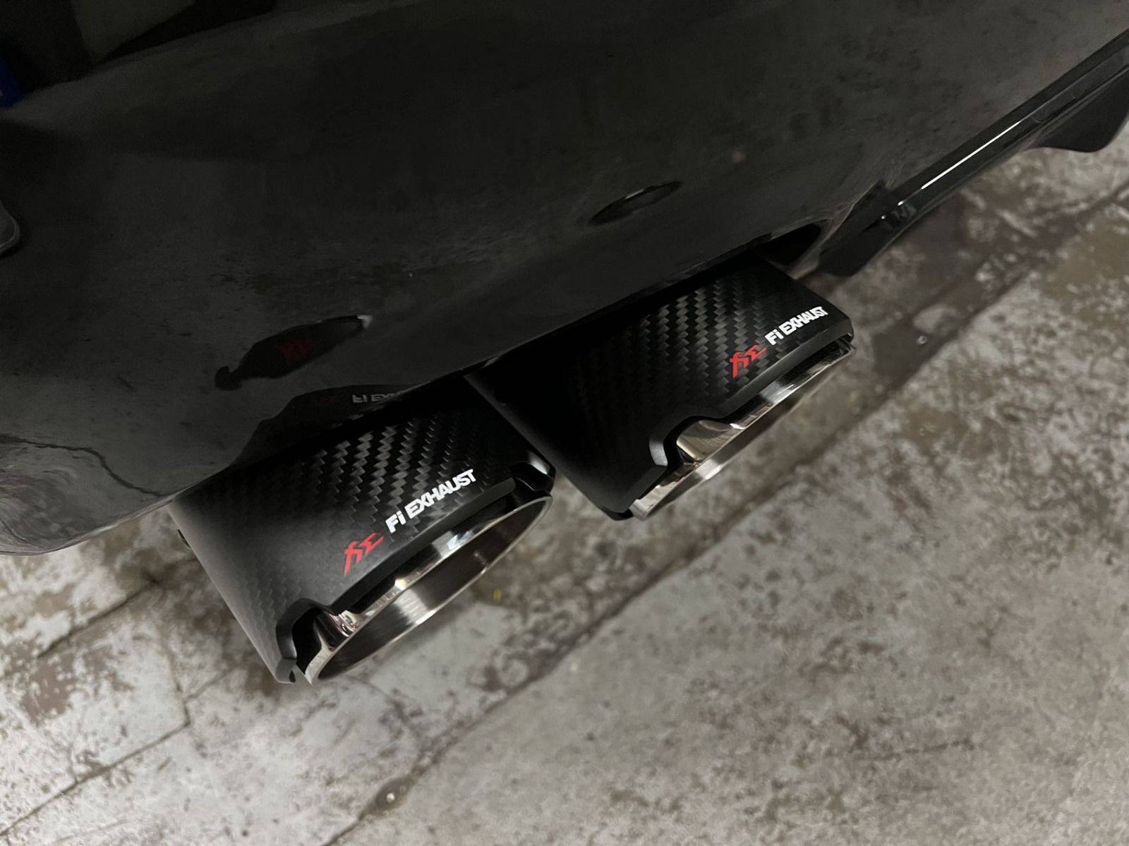 Two carbon fiber exhaust tips with 