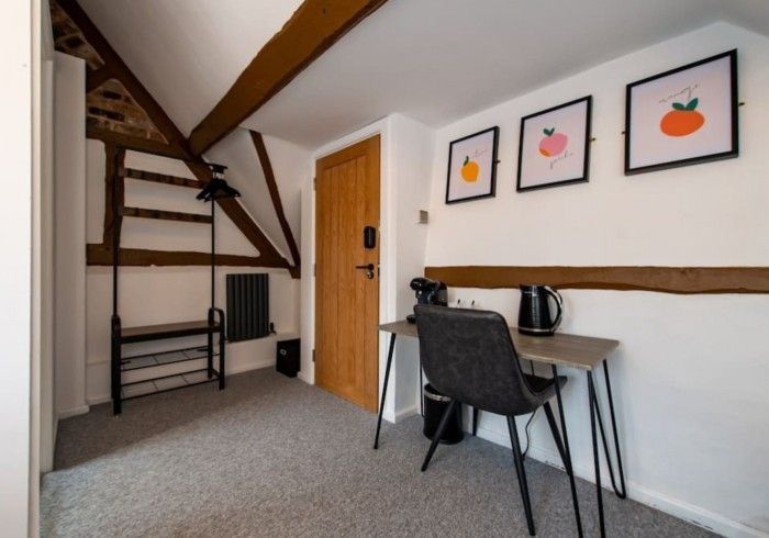 A room with a desk and chair in it