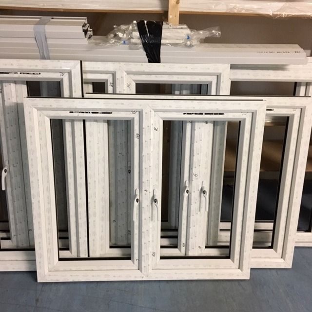 a bunch of white windows are stacked on top of each other