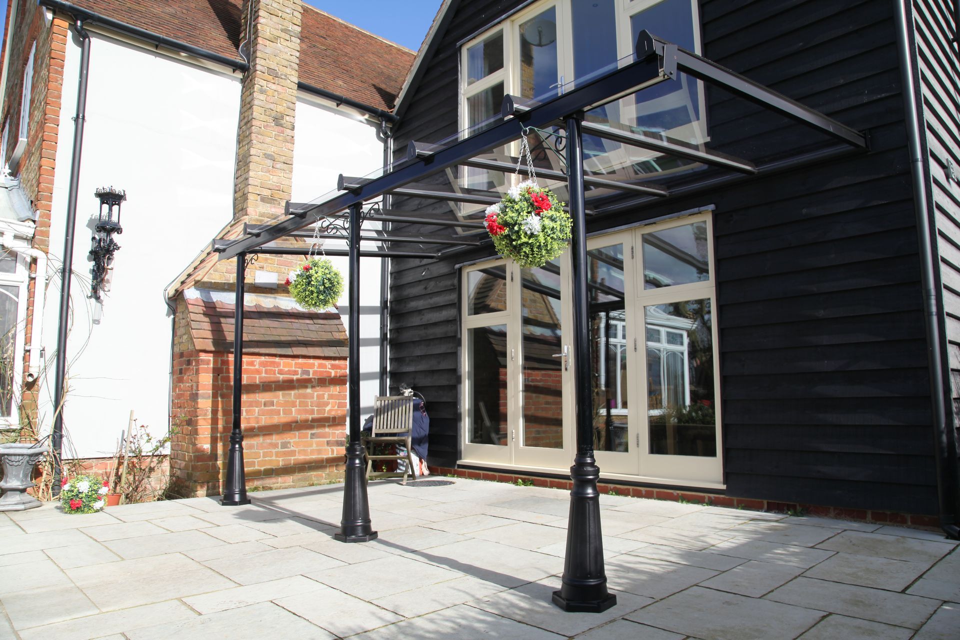 A black building with a patio in front of it