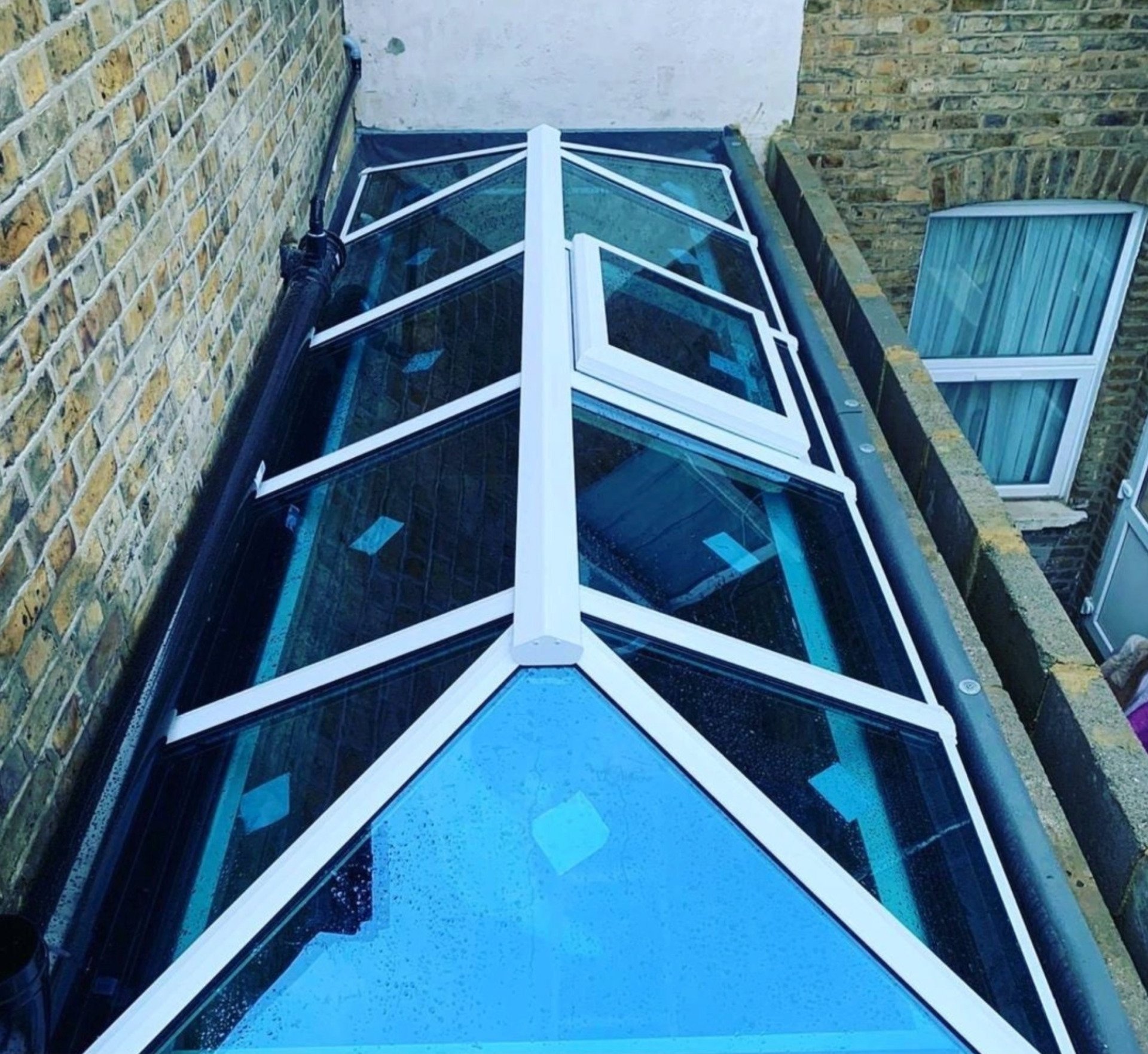 The roof of a building has a glass roof