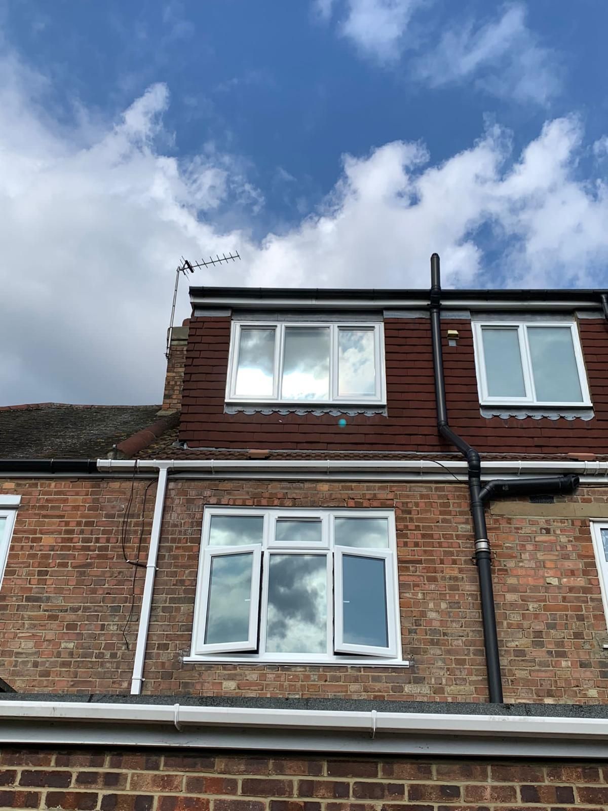 A brick building with a blue sky in the background