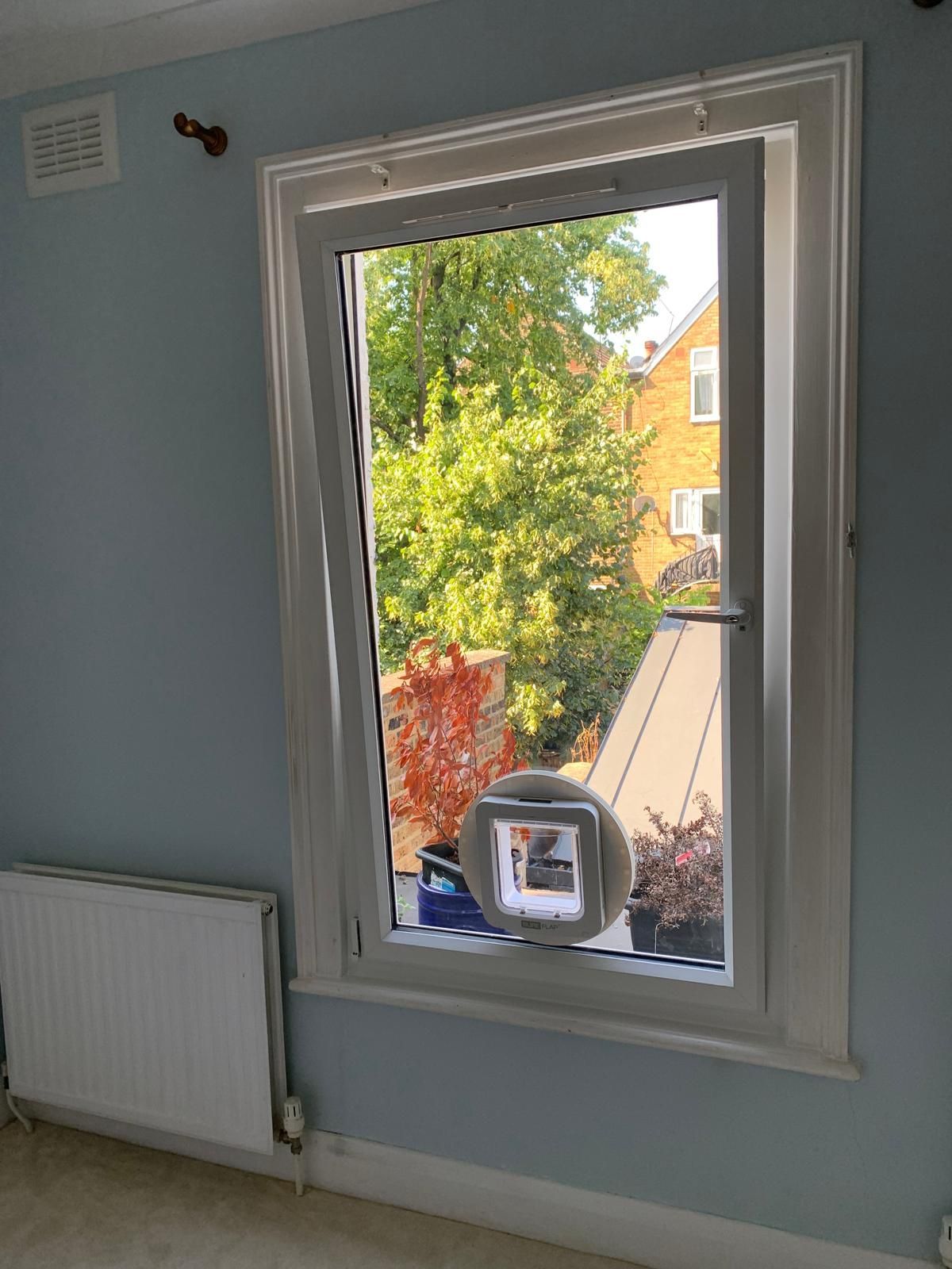 A room with a window and a radiator in it