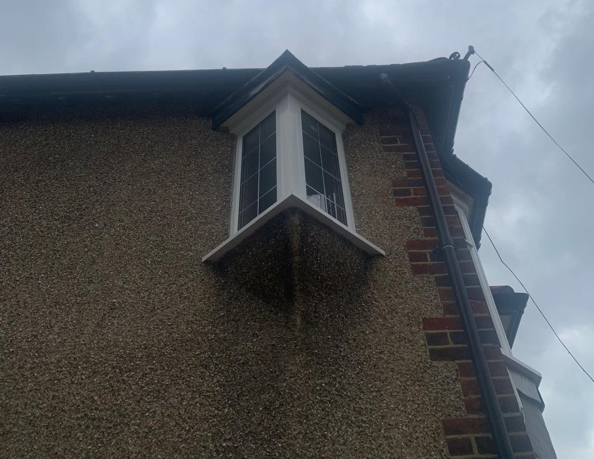 A building with a window on the side of it