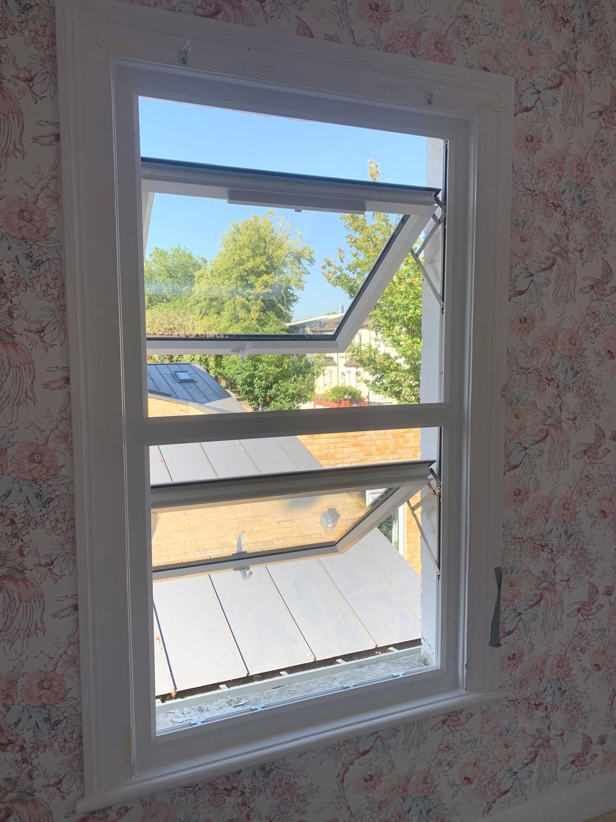 A window in a room with a view of a house