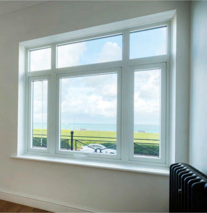 A large window with a view of the ocean