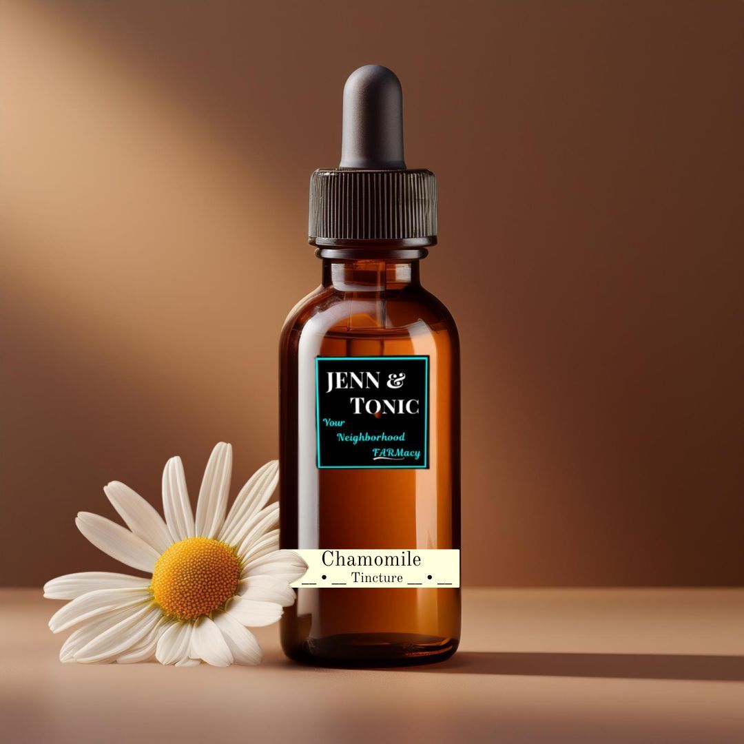 A bottle of jenn & tonic next to a daisy