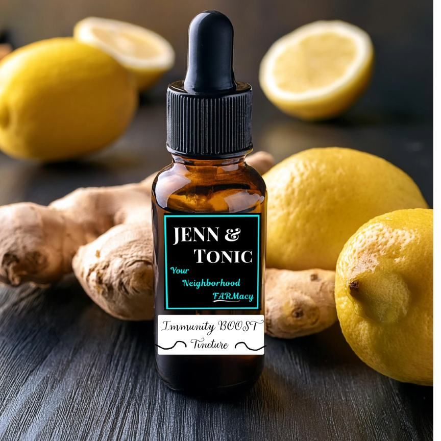 A bottle of jenn & tonic next to lemons and ginger