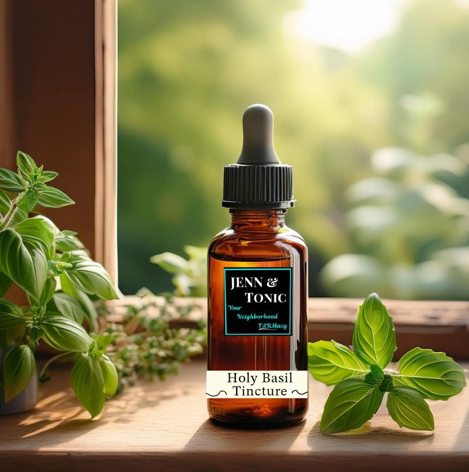 A bottle of jenn & tonic holy basil tincture is sitting on a window sill.
