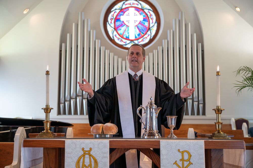 Dr. Threadgill giving communion