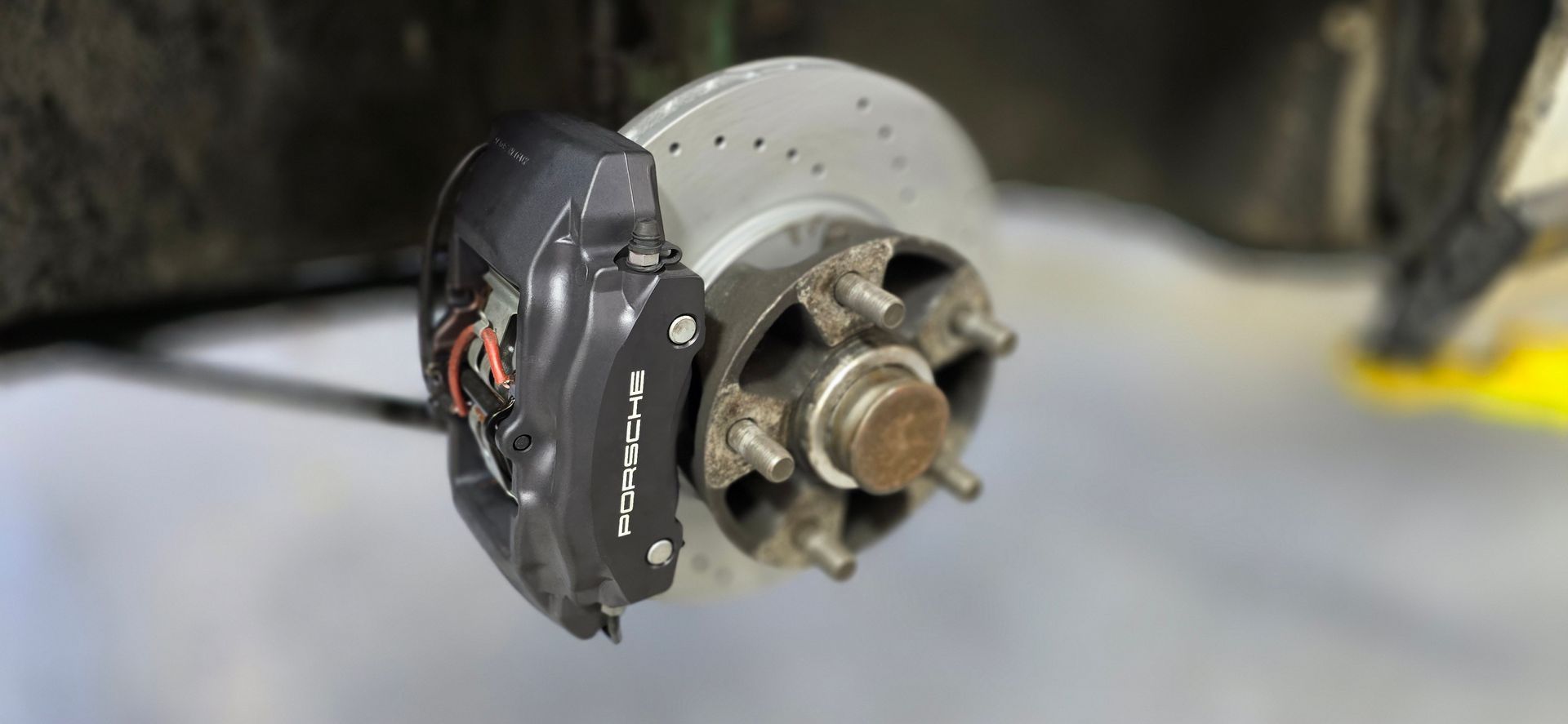 A close up of a brake caliper on a car | Griffin Motorwerke