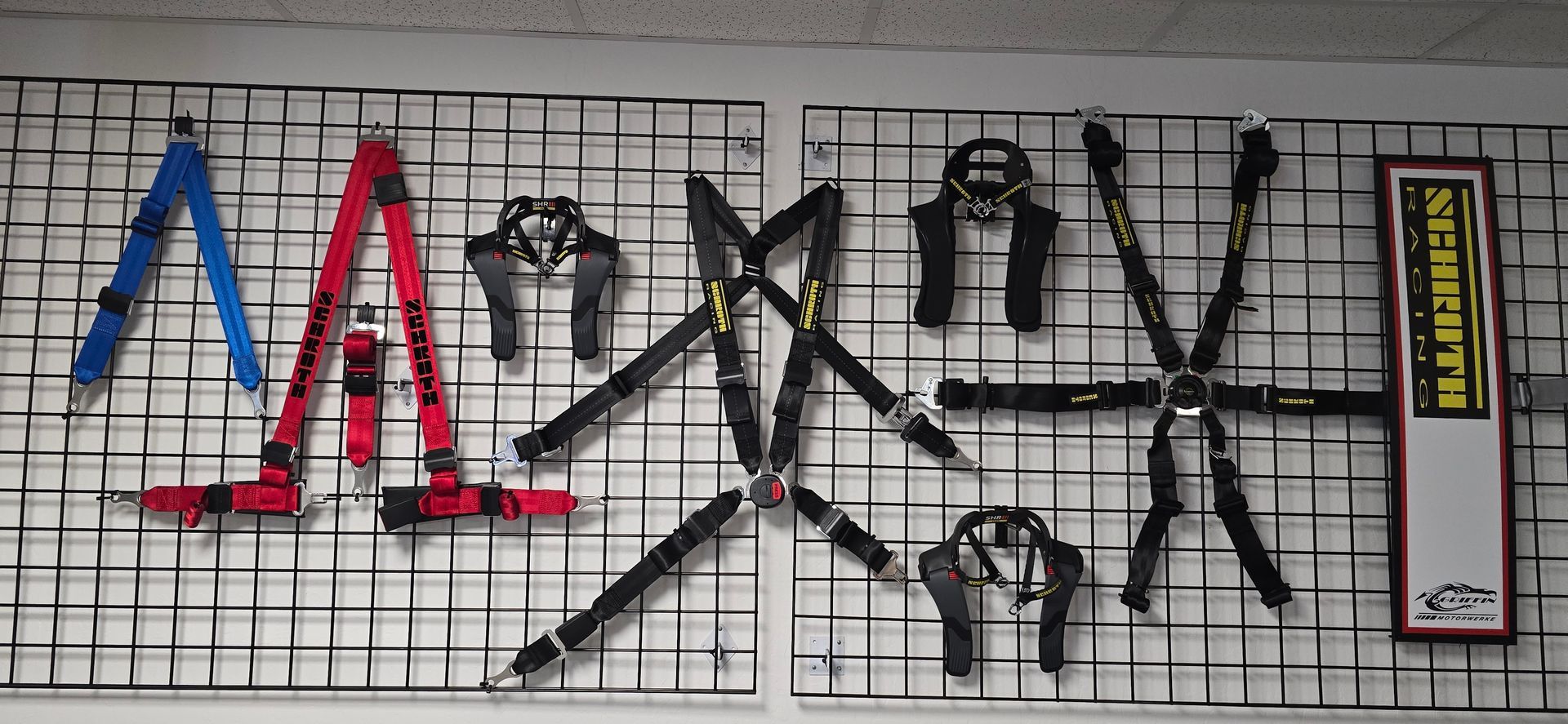 A wall with a bunch of scissors hanging on it | Griffin Motorwerke