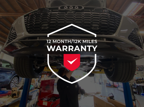 A man is working on a car with a 12 month / 12k miles warranty | Griffin Motorwerke