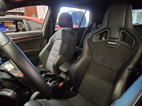 A car with a recaro seat and a steering wheel | Griffin Motorwerke