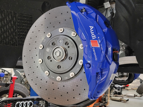 A close up of a blue audi brake disc | Griffin Motorwerke