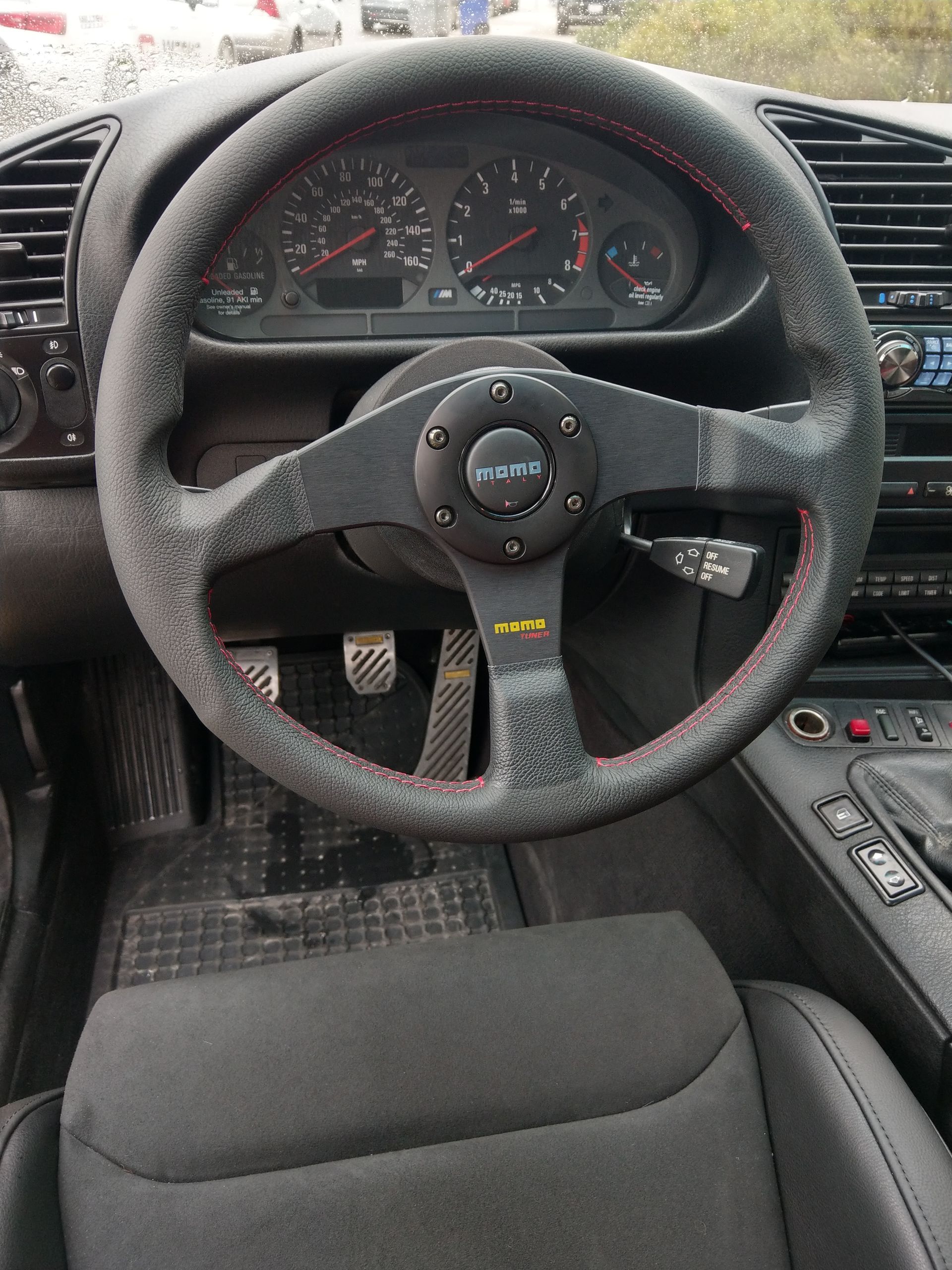 A black car with a steering wheel and a dashboard | Griffin Motorwerke