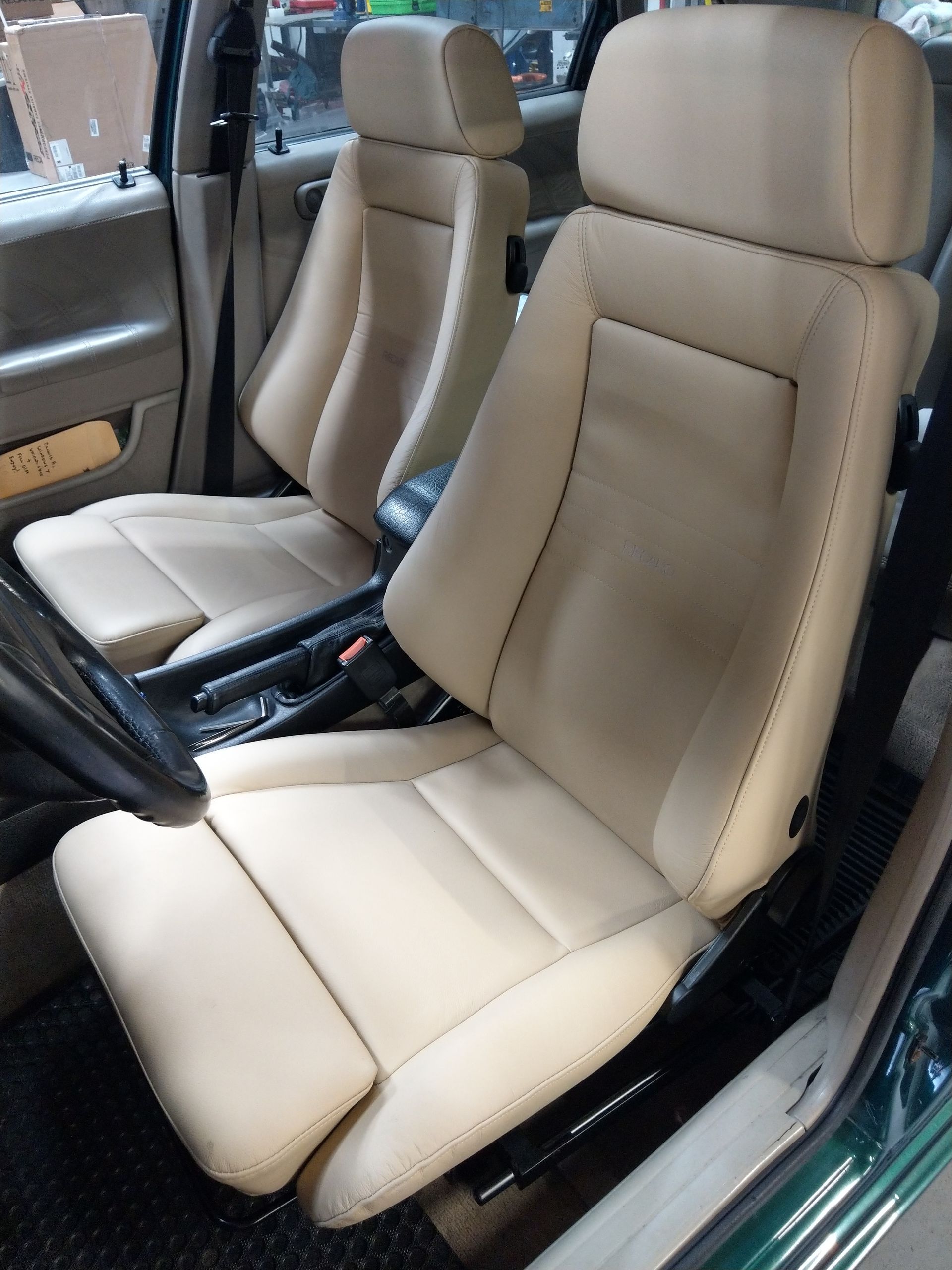 A pair of tan leather seats in a car | Griffin Motorwerke