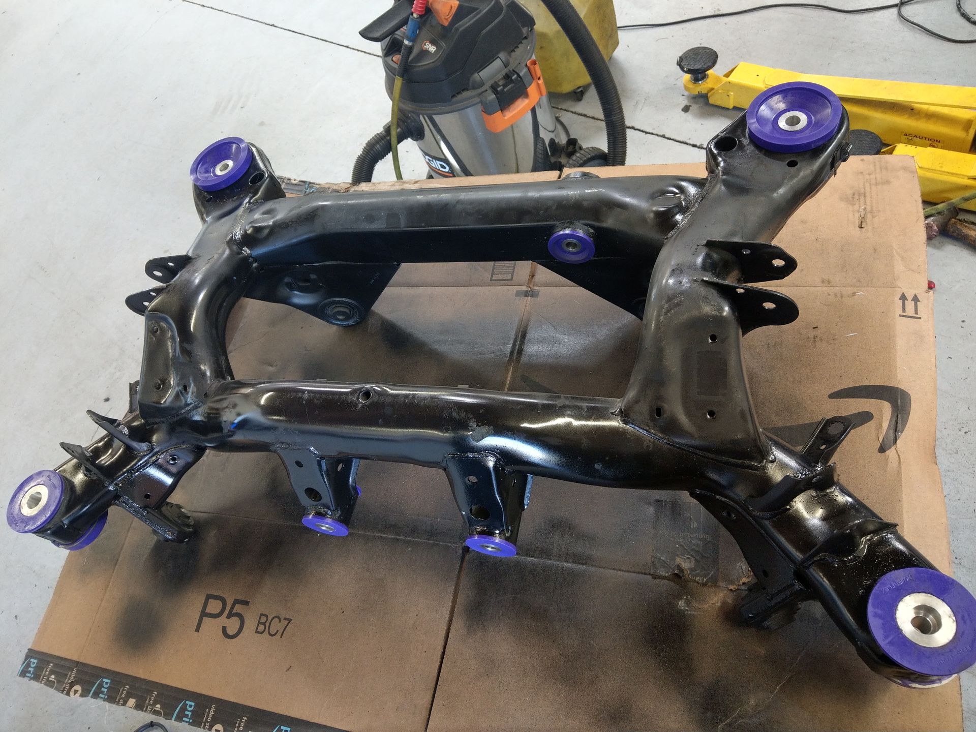 A piece of metal sitting on top of a cardboard box labeled p5 | Griffin Motorwerke