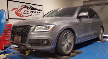 A gray audi q5 is sitting on a dyno in a garage | Griffin Motorwerke