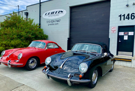 Two old cars are parked in front of a building | Griffin Motorwerke