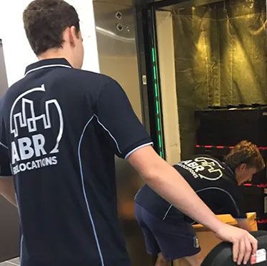 A man wearing a shirt that says abr on the back