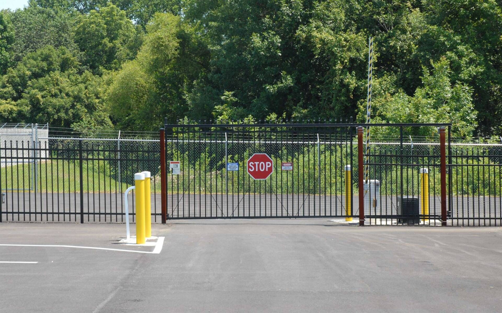 A steel fence with a stop sign on it