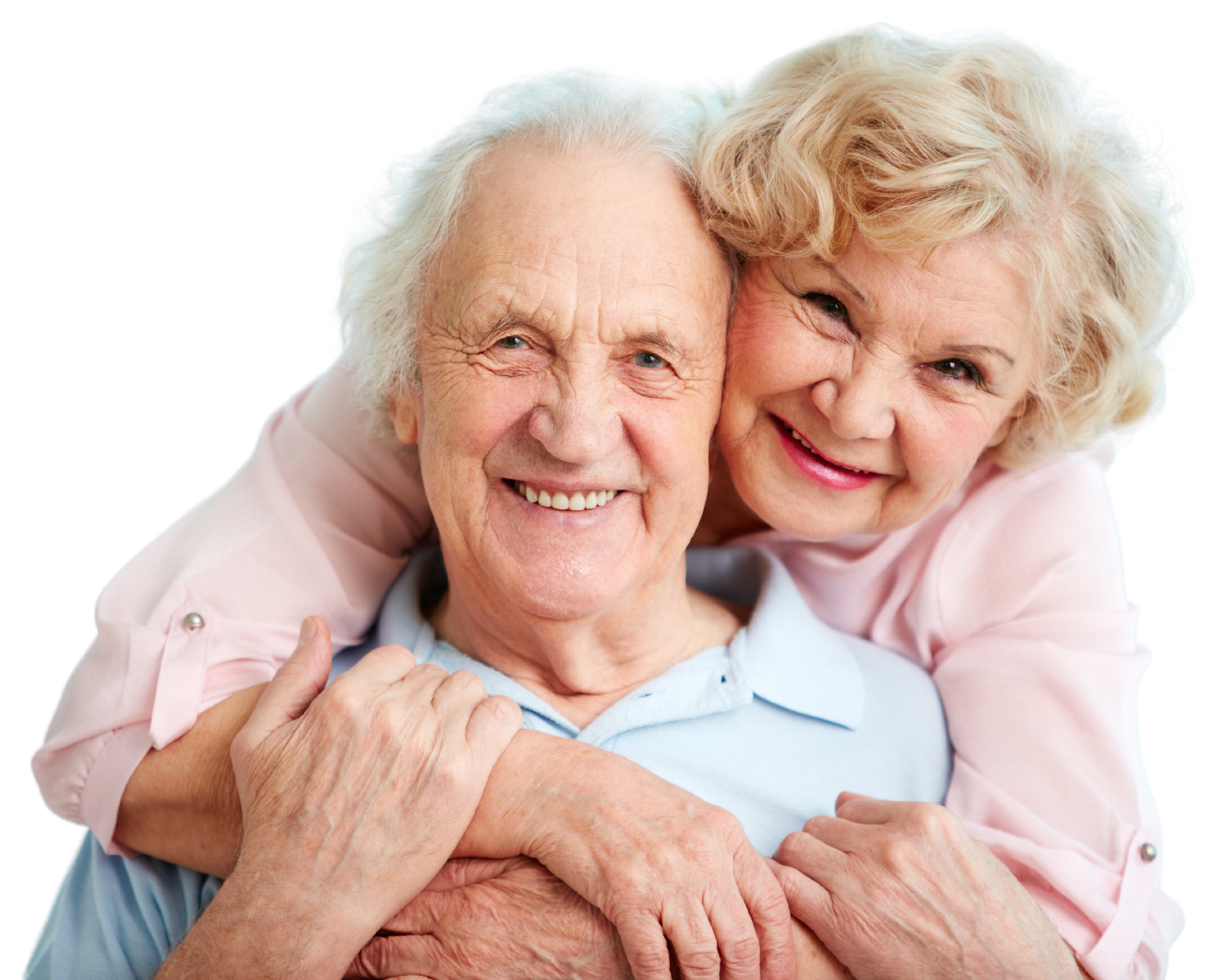 Elderly couple smiling, embracing, with the woman's arms around the man, against a white background.