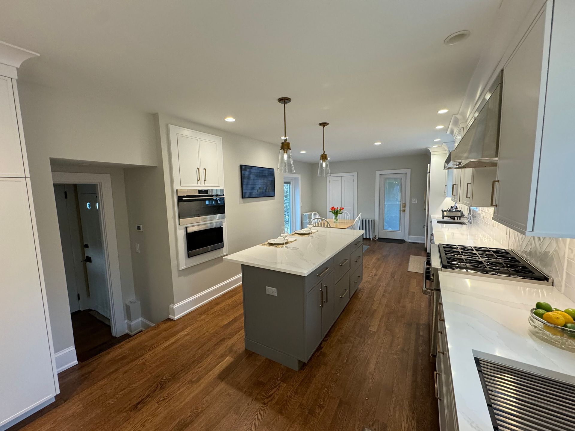 a kitchen with a large island in the middle of it .