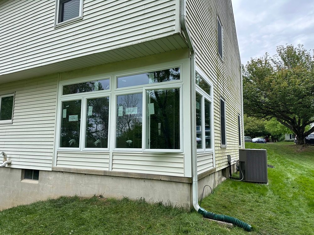 a house with a lot of windows on the side of it .