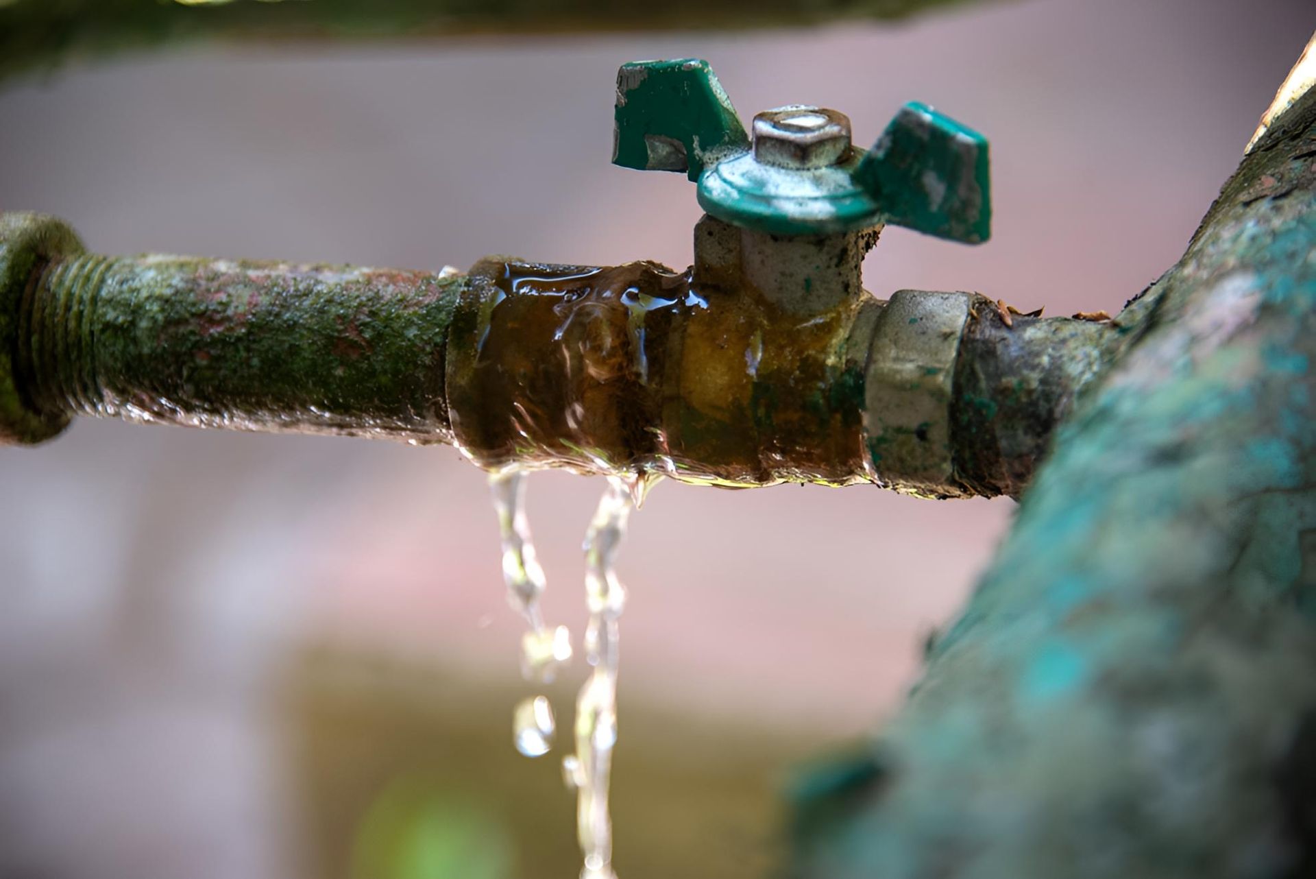 Close Up of a Faucet With Water Leaking — Luke Barry Plumbing in Southport, QLD