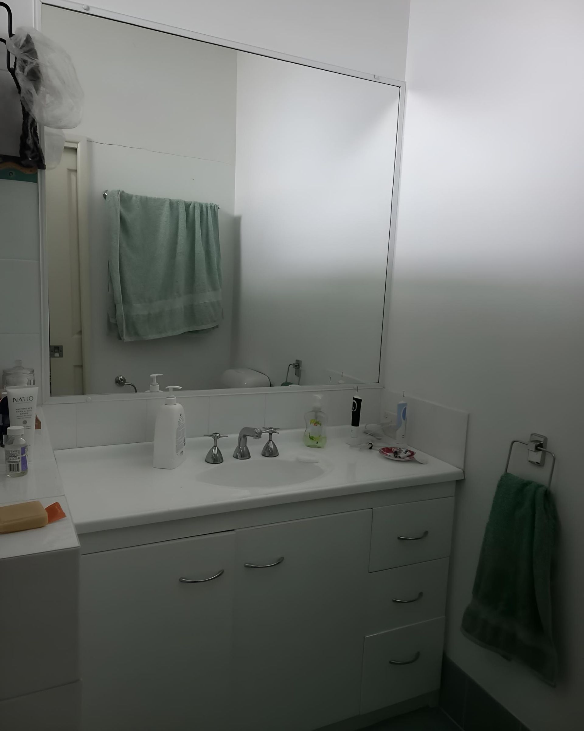 Bathroom With a Sink and a Large Mirror — Luke Barry Plumbing in Tugun, QLD