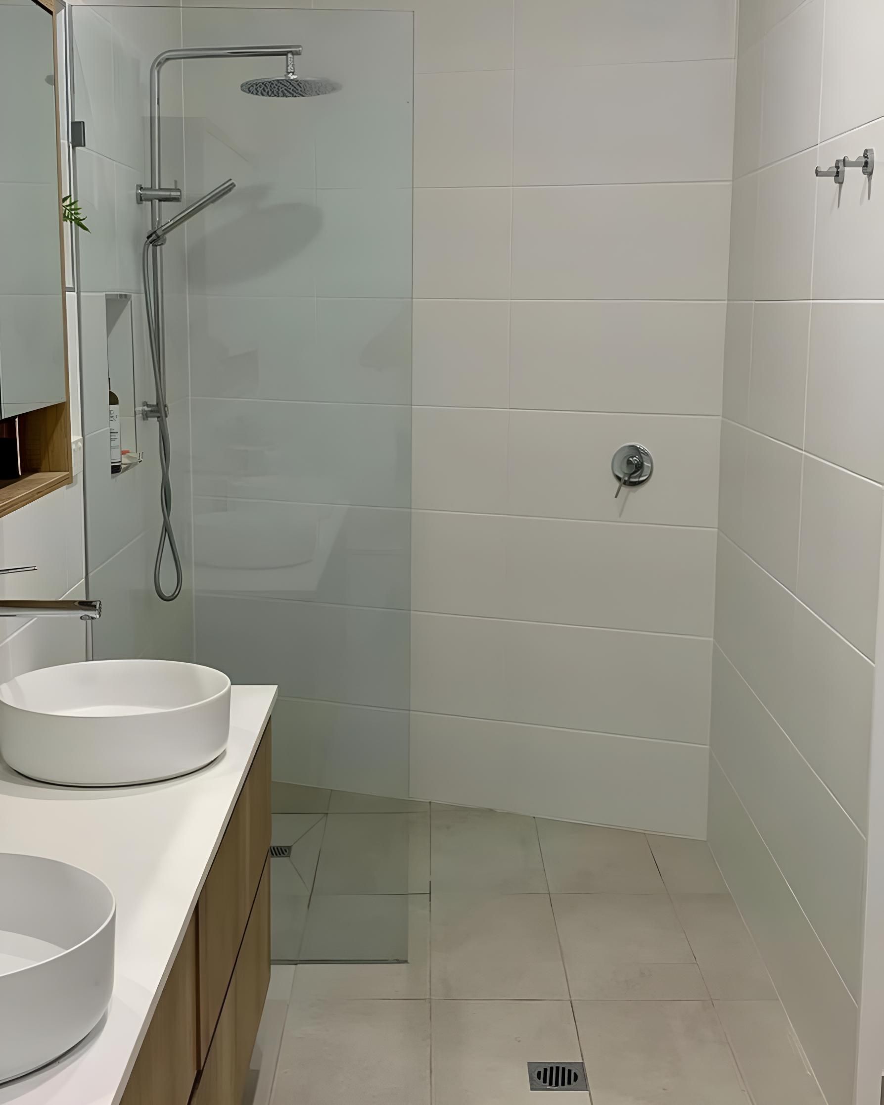 Bathroom With Two Sinks and a Walk in Shower — Luke Barry Plumbing in Helensvale, QLD