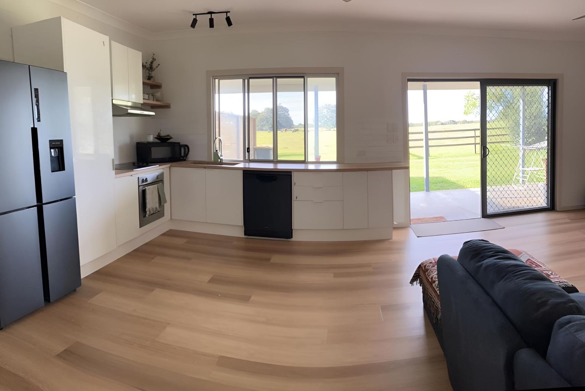 Kitchen With a Couch and a Refrigerator — Luke Barry Plumbing in Sanctuary Cove, QLD
