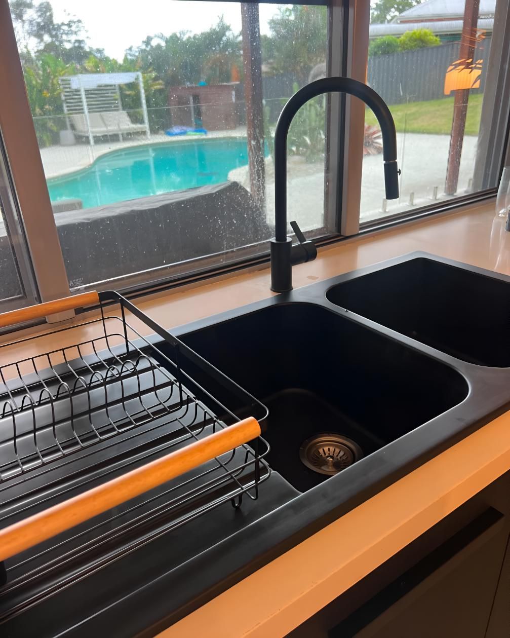 Kitchen Sink With a Swimming Pool — Luke Barry Plumbing in Ormeau, QLD