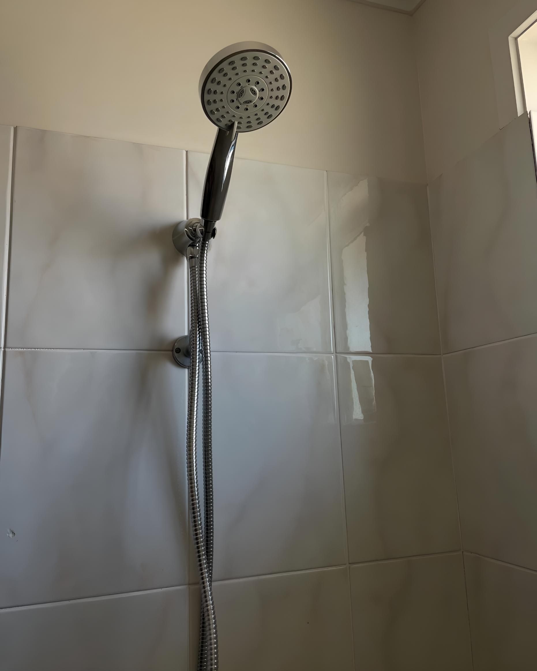Close Up of a Shower Head in a Bathroom — Luke Barry Plumbing in Runaway Bay, QLD