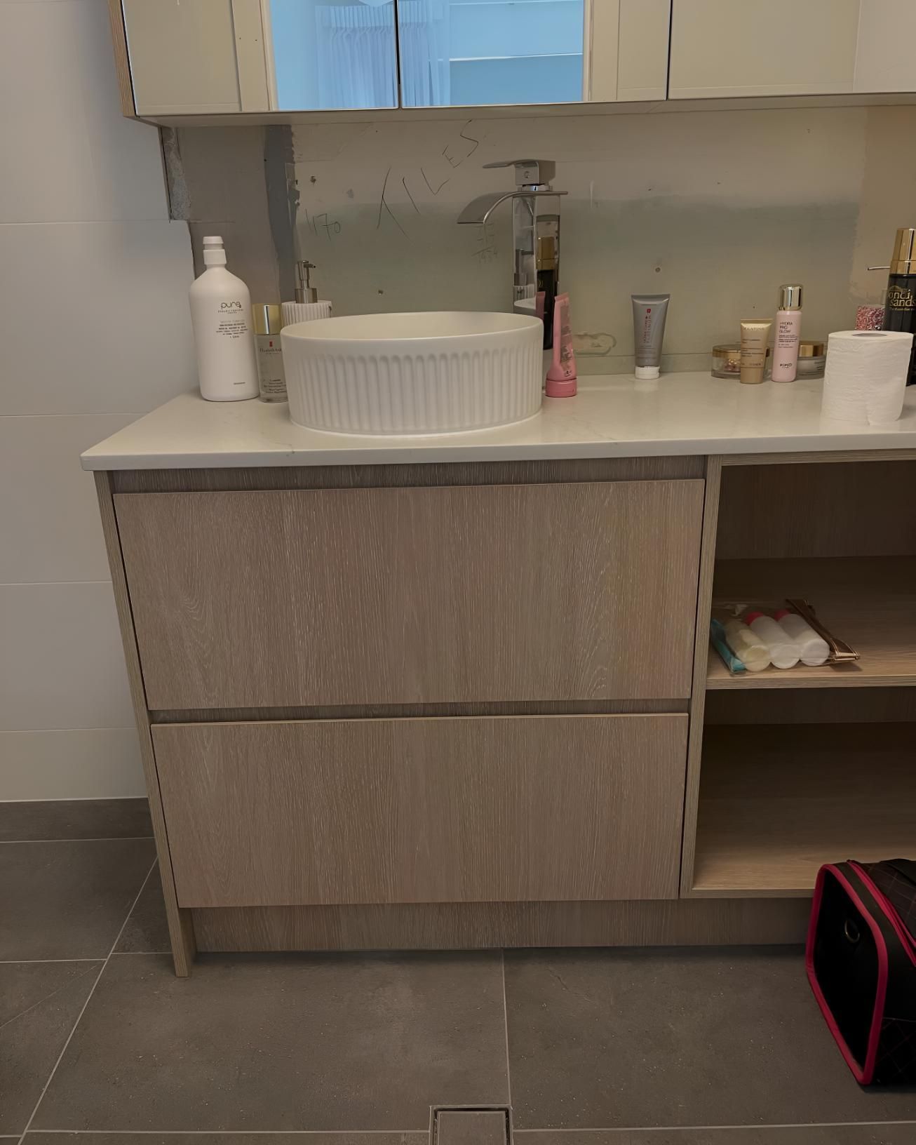Bathroom Vanity With a Sink and a Mirror — Luke Barry Plumbing in Coomera, QLD
