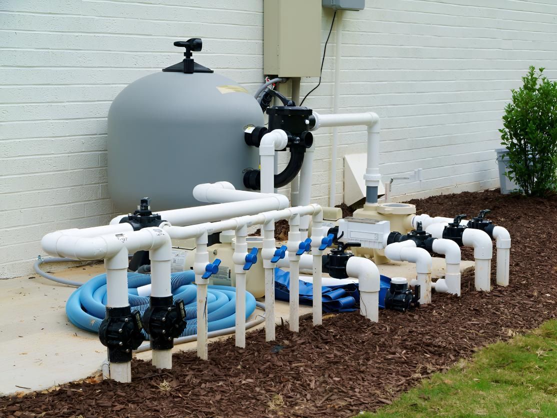 Swimming Pool Filter is Sitting Next to Pipes — Luke Barry Plumbing in Main Beach, QLD