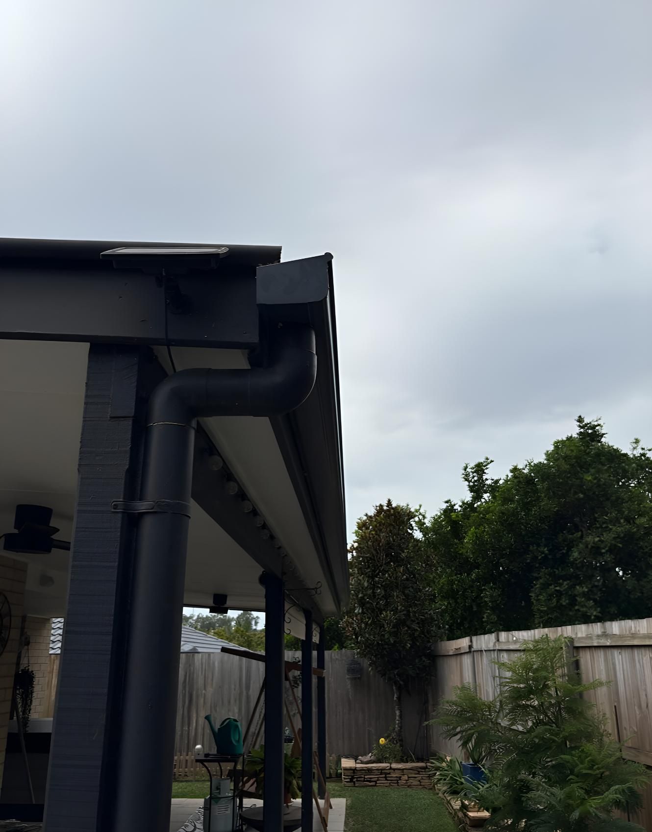 Black Gutter on the Side of a House — Luke Barry Plumbing in Ormeau, QLD