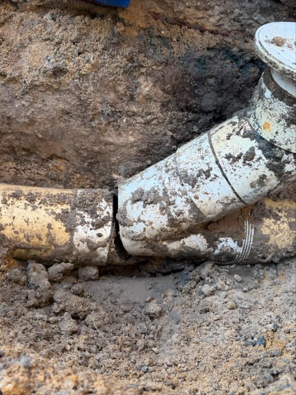 Close Up of a Muddy Pipe in the Dirt — Luke Barry Plumbing in Ormeau, QLD