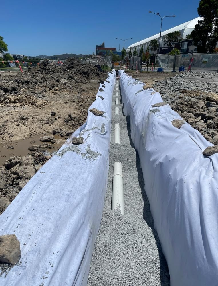 Drainage Pipe is Being Installed in a Trench — Luke Barry Plumbing in Mermaid Waters, QLD