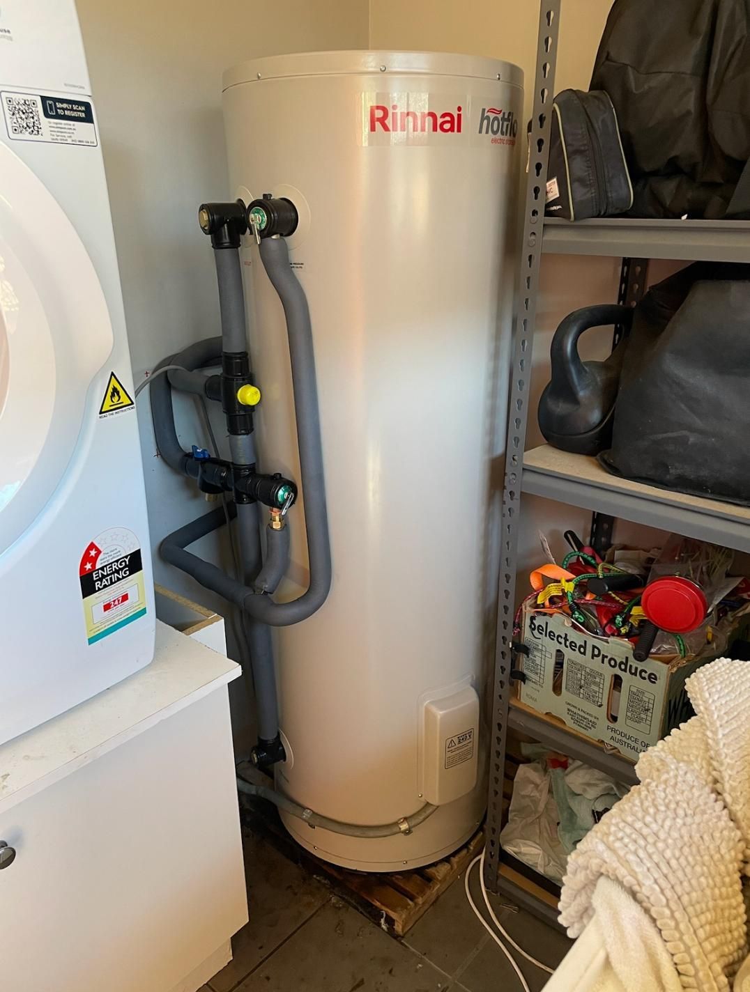 Water Heater is Sitting in a Laundry Room — Luke Barry Plumbing in Coomera, QLD