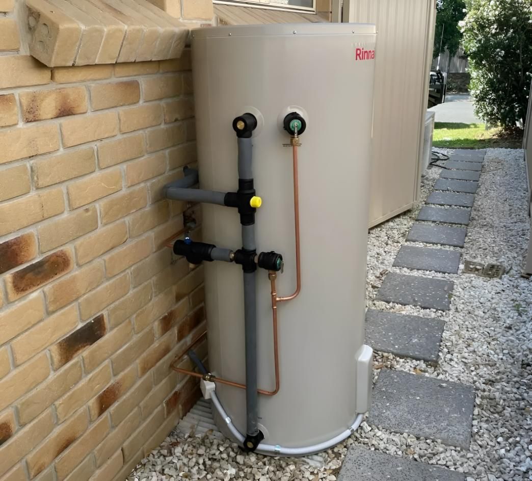 Water Heater is Attached to a Brick Wall — Luke Barry Plumbing in Mudgeeraba, QLD
