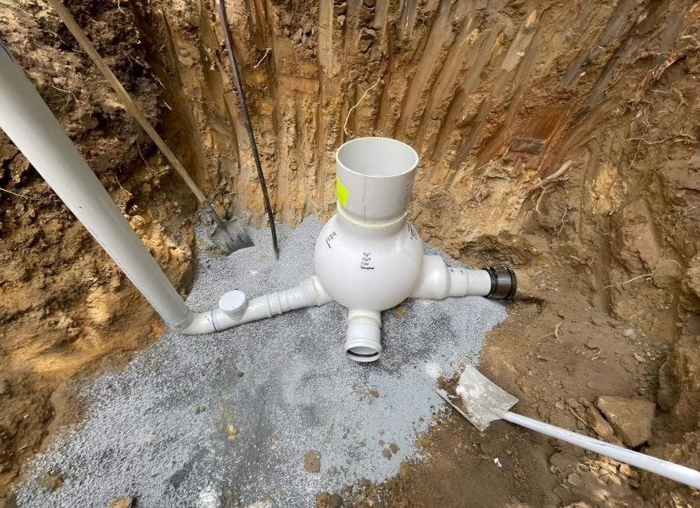 Drain Pipe is Being Installed in a Hole in the Ground — Luke Barry Plumbing in Mudgeeraba, QLD